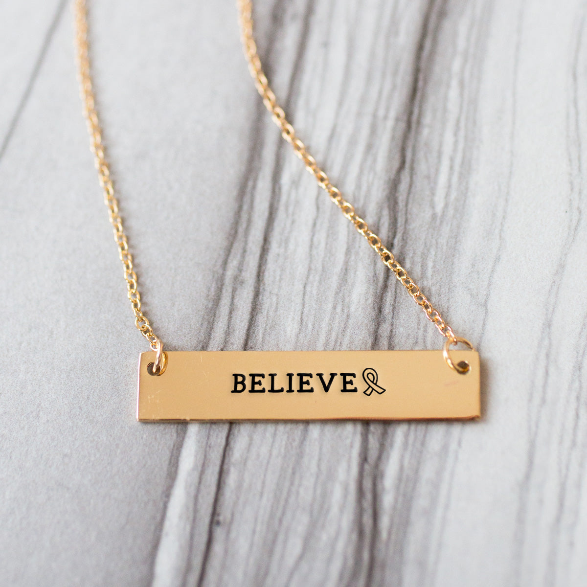Gold Believe Ribbon Bar Necklace